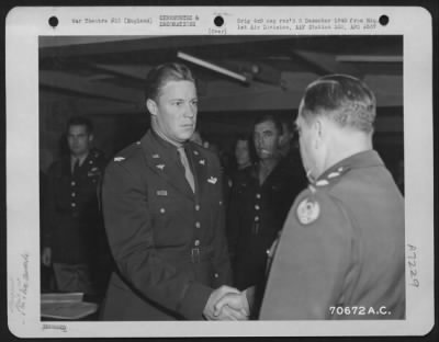 Awards > Colonel Preston, Attached To Hdq., 1St Bomb Division, Is Congratulated By Brig. General Robert B. Williams During A Ceremony At An 8Th Air Force Base In England On 5 June 1944.