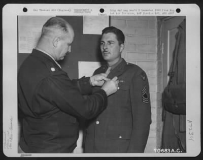 Awards > M/Sgt. Sulliven, Attached To Hdq., 1St Bomb Division , Receives An Award During A Ceremony At An 8Th Air Force Base In England On 5 January 1945.