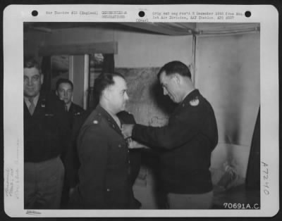 Thumbnail for Awards > Colonel Damidovich, Attached To Hdq., 1St Bomb Division, Is Presented An Award By Brig. General Howard M. Turner During A Ceremony At On 10 April 1945 At An 8Th Air Force Base In England.