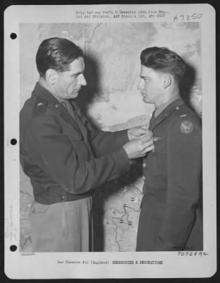 Thumbnail for Awards > Lt. Augsutino, Attached To Hdq., 1St Bomb Division, Receives An Award From Brig. General Bartlett Beaman During A Ceremony On 19 June 1945 At An 8Th Air Force Base In England.