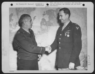 Awards > Brig. General Frank A. Armstrong Congratulates Colonel William M. Gross, Attached To Hdq., 1St Bomb Division, After Presenting Him With The Purple Heart And Air Medal During A Ceremony Somewhere In England.  7 July 1943.