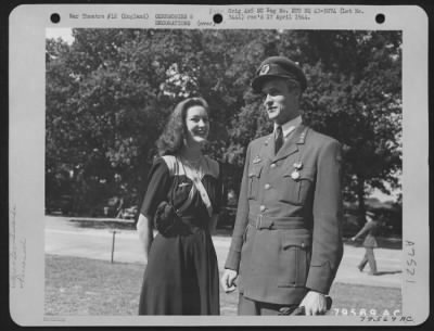 Thumbnail for Awards > Capt. Thorveld Johnson Of The Norwegian Air Force Receives The Congratulations Of His Wife After He Received The Air Medal During A Ceremony At The 8Th Air Force Base At Teddington, England On 17 July 1943.