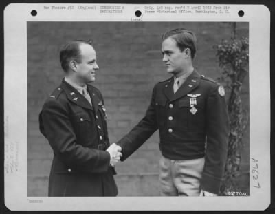 Thumbnail for Awards > Lt. Boehner And Lt. Kenyon Of The 458Th Bomb Group, Congratulate Each Other After Receiving The Distinguished Flying Cross During A Ceremony At An Air Base Somewhere In England.  21 December 1944.