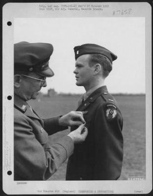 Awards > 1St Lt. Woodrow V. Timo Of 316Th Troop Carrier Group, 19Th Troop Carrier Command Is Presented The Distinguished Flying Cross By Lt. Gen. Lewis H. Brereton During A Ceremony At Cottesmore, England.  25 April 1945.