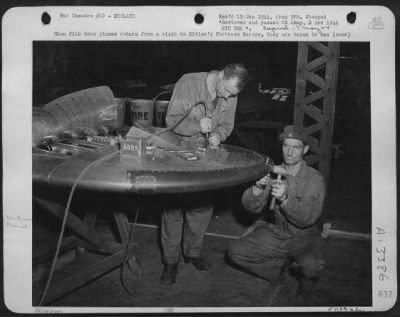 General > When flak torn planes return from a visit to Hitler's ofrtress Europe, they are taken to one of the Eighth Air force Service Command Repair Depots. In this picture Pfc. David Rosner of Hartofrd, Conn., left, and Sgt. Joseph J. Tucker, Coleman