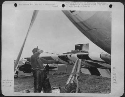 Thumbnail for General > An Eighth Fighter Command North American P-51 Mustang armorer cleans the barrel of one of the four .50 caliber machine guns set in the wings of the plane. His pilot has just landed from one combat mission over France and the guns must be cleaned