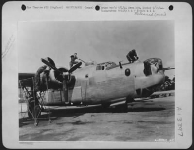 Thumbnail for General > ENGLAND-Ground crew going over a B-24 Liberator with a fine comb after its return from a mission.