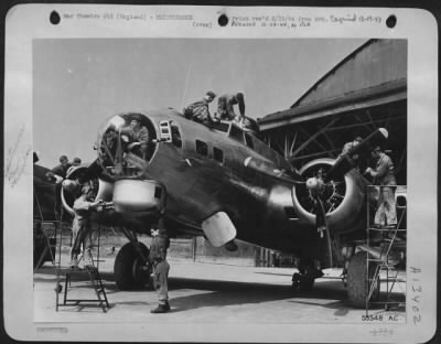 Thumbnail for General > Mechanics swarm over the b-17 Flying ofrt, each at work on his own special job, at an 8th Air force base depot in England where planes newly arrived from America are modified for combat according to the latest discoveries resulting from combat