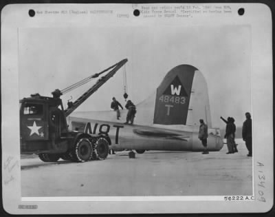 General > Whenever a heavy bomber returns to this Boeing B-17 Flying ofrtress base in a crippled condition from a bombing attack over Germany, members of the ground crew are always on the spot to make the necessary repairs. As soon as this plane landed with