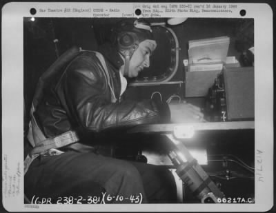 Radio Operator > Sgt. Lancia At His Position In Radio Compartment Of A 381St Bomb Group Boeing B-17 Flying Fortress, 6 October 1943.  England.