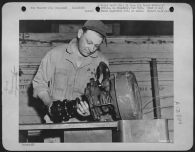 General > T/Sgt. Emmett Pfluger, Of Eden, Texas, Is Shown Assembling Hoist, Which Enables Two Men To Load Twice As Much As Was Formerly Possible With Twice The Number Of Men.