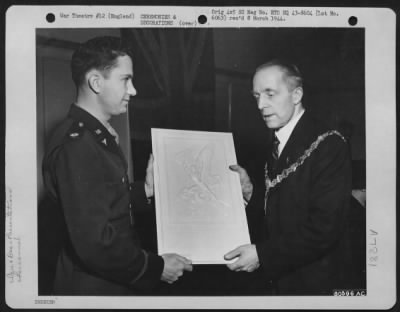 Thumbnail for Miscellaneous > Lt. Colonel Lewis E. Lyle, Left, Of Pine Bluff, Ark., Bomber Pilot And Deputy Group Commander, Presents A Commemorative Plaque In Tribute To The Borough Of Bermondsey, England For Having Raised The Amount Of Money Equivalent To The Price Of 20 Boeing B-17