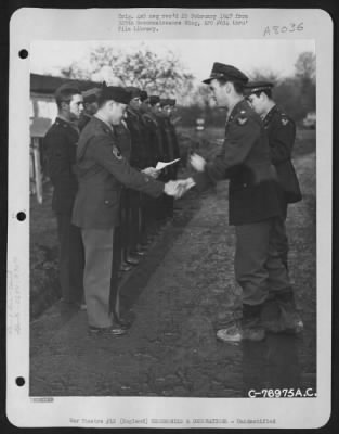 Thumbnail for Unidentified > A Member Of The 569Th Bomb Squadron, 390Th Bomb Group, Is Congratulated After Receiving An Award During A Ceremony At An Air Base In England.  20 November 1944.