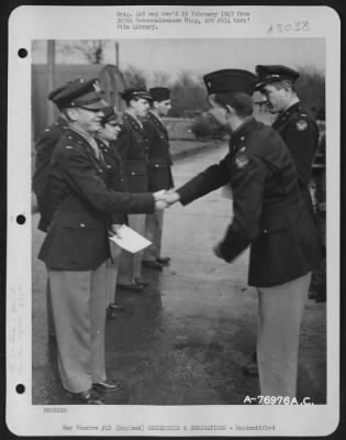 Thumbnail for Unidentified > A Member Of The 569Th Bomb Squadron, 390Th Bomb Group, Is Congratulated After Receiving An Award During A Ceremony At An Air Base In England.  23 February 1944.