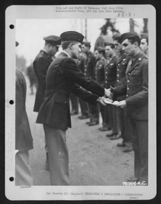 Thumbnail for Unidentified > A Member Of The 569Th Bomb Squadron, 390Th Bomb Group Is Congratulated After Receiving An Award During A Ceremony At An Air Base Somewhere In England.  22 January 1944.