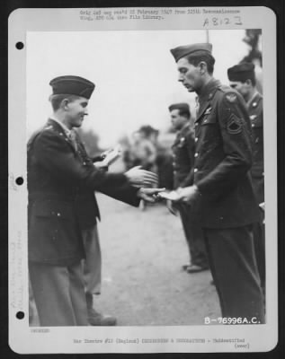 Thumbnail for Unidentified > A Member Of The 569Th Bomb Squadron, 390Th Bomb Group Is Congratulated After Receiving An Award During A Ceremony At An Air Base Somewhere In England.  22 January 1944.