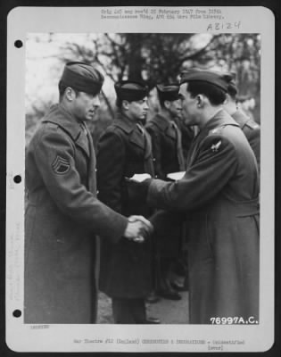 Thumbnail for Unidentified > A Member Of The 570Th Bomb Squadron, 390Th Bomb Group Is Congratulated After Receiving An Award During A Ceremony At An Air Base Somewhere In England.  9 January 1944.