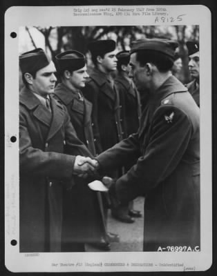 Thumbnail for Unidentified > A Member Of The 570Th Bomb Squadron, 390Th Bomb Group Is Congratulated After Receiving An Award During A Ceremony At An Air Base Somewhere In England.  9 January 1944.