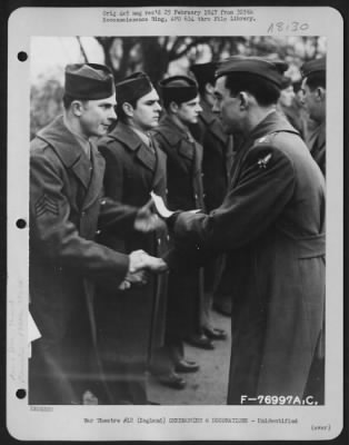 Thumbnail for Unidentified > A Member Of The 570Th Bomb Squadron, 390Th Bomb Group Is Congratulated After Receiving An Award During A Ceremony At An Air Base Somewhere In England.  9 January 1944.