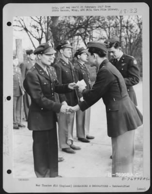 Thumbnail for Unidentified > A Member Of The 570Th Bomb Squadron, 390Th Bomb Group Is Congratulated After Receiving An Award During A Ceremony At An Air Base Somewhere In England.  28 January 1944.