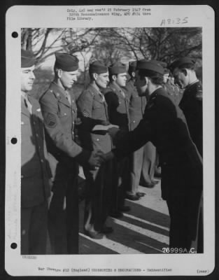 Thumbnail for Unidentified > A Member Of The 570Th Bomb Squadron, 390Th Bomb Group Is Congratulated After Receiving An Award During A Ceremony At An Air Base Somewhere In England.  1 March 1944.