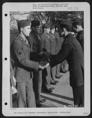 Thumbnail for Unidentified > A Member Of The 570Th Bomb Squadron, 390Th Bomb Group Is Congratulated After Receiving An Award During A Ceremony At An Air Base Somewhere In England.  1 March 1944.