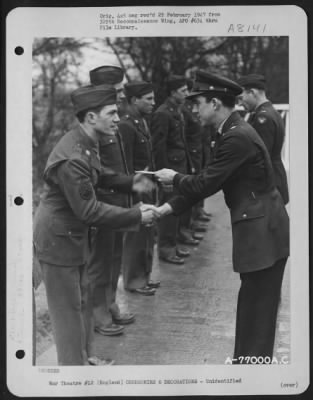 Thumbnail for Unidentified > A Member Of The 570Th Bomb Squadron, 390Th Bomb Group Is Congratulated After Receiving An Award During A Ceremony At An Air Base Somewhere In England.  19 March 1944.