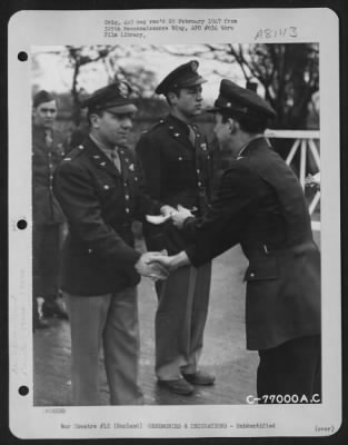 Thumbnail for Unidentified > A Member Of The 570Th Bomb Squadron, 390Th Bomb Group Is Congratulated After Receiving An Award During A Ceremony At An Air Base Somewhere In England.  19 March 1944.