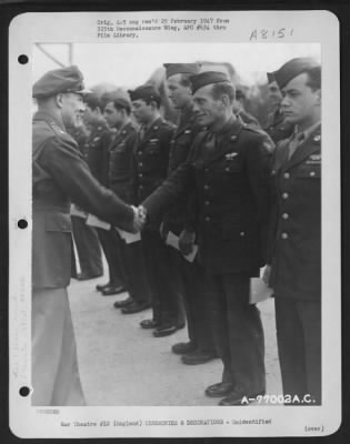 Thumbnail for Unidentified > A Member Of The 571St Bomb Squadron, 390Th Bomb Group Is Congratulated After Receiving An Award During A Ceremony At An Air Base Somewhere In England.  11 March 1944.