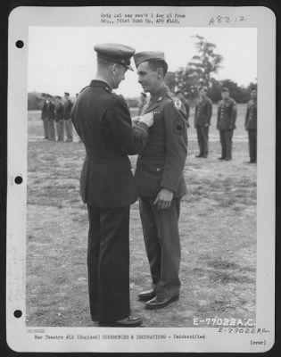 Unidentified > Brig. Gen. Samuel E. Anderson Congratulates A Member Of The 391St Bomb Group On Receiving The Legion Of Merit During A Ceremony At An Air Base In England.  27 July 1944.