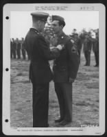 Brig. Gen. Samuel E. Anderson Congratulates A Member Of The 391St Bomb Group On Receiving The Legion Of Merit During A Ceremony At An Air Base In England.  27 July 1944. - Page 19