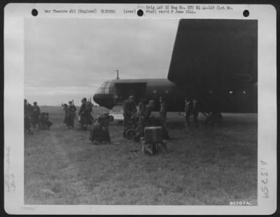 General > American Airborne Troops Unload Equipment From A Glider During Maneuvers Of The 101St Airborne Division At Berks, England In January 1944.