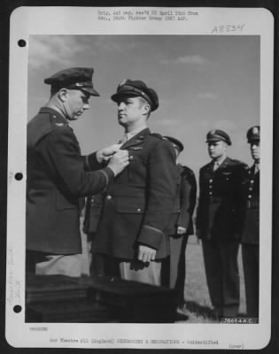 Thumbnail for Unidentified > An Officer Presents The Air Medal To A Member Of The 314Th Service Group Of The 364Th Fighter Group During A Ceremony At An Airbase Somewhere In England.  25 May 1944.