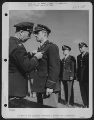 Thumbnail for Unidentified > An Officer Presents The Air Medal To A Member Of The 314Th Service Group Of The 364Th Fighter Group During A Ceremony At An Airbase Somewhere In England.  25 May 1944.