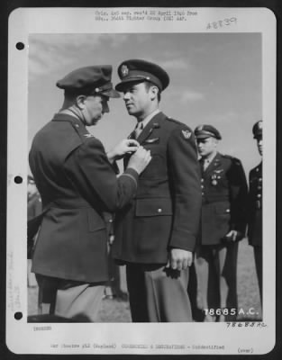 Thumbnail for Unidentified > An Officer Presents The Air Medal To A Member Of The 314Th Service Group Of The 364Th Fighter Group During A Ceremony At An Airbase Somewhere In England.  25 May 1944.