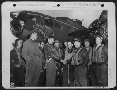 Consolidated > It's the Boeing B-17 Flying ofrtress "Knockout Dropper," who gets the medals this trip. On Armistice Day she came home with a USAAF record--50 operational flights (bombs dropped each time) over the ofrtress Europe. Here her pilot (only one of many