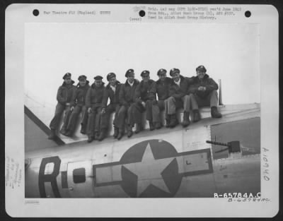 General > Lt. Harveson And Crew Of The 612Th Bomb Squadron, 401St Bomb Group, Sitting On  A Boeing B-17 "Flying Fortress" At An 8Th Air Force Base In England.  31 March 1945.
