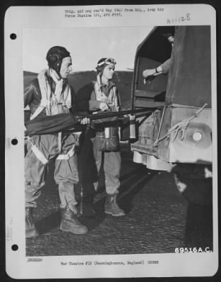 General > After Returning From A Mission Over Nazi Installations In Europe On 5 November 1943, The Waist Gunner On A Boeing B-17 "Flying Fortress" Puts His 50 Cal. Machine Gun Into The Truck Which Will Take Him, The Radio Operation (Shown) And Other Crew Members To
