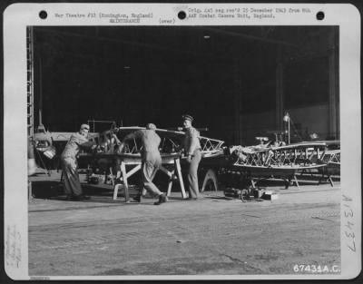 Thumbnail for General > Installation Of A 'Tokyo Tank' (Fuel Tank) In The Wing Section Of A Boeing B-17 "Flying Fortress" At The 1St Strategic Air Depot Near Honnington, England.  1943.