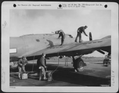 Thumbnail for General > Ground Crew Members Defrost The Wings Of A Weather Plane Prior To Its Take-Off In Bovington, England.  They Are, Left To Right: Cpl. Walter Mazure, Detroit, Mich., And Sgt. J.A. Donaldson, Georgetown, Illinois, On Wing; Pvt E.A. Maclachlan, Detroit, Mich.