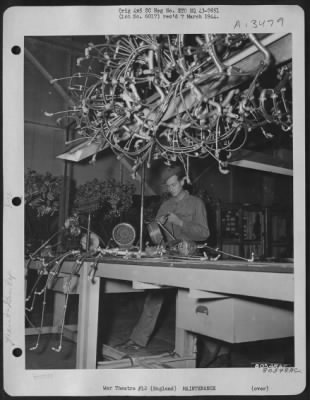 Thumbnail for General > At The Warrington Burtonwood Air Depot In England, Where Flak-Torn Planes Are Repaired And Modified For Future Missions, Pvt. Gerald D. Turner Of Oklahoma Works Amidst A Tangle Of Fuel Lines.  30 October 1943.