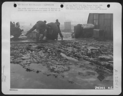 Thumbnail for Tires & Wheels > The muddy condition of airfields in England is no picnic for the maintenance crews of the 8th AF.