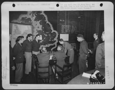 Thumbnail for General > Planning a bombing mission in operations room: left to right: Maj. George Jones, Col. Harris Hull, Lt. Col. Stuart Porter, Lt. Col. W.H. Cleveland, Co. C.B.B. Bubb, Brig. Gen. N. Longfellow, Capt. C.F. Bourne, Maj. R.H. Stuart, Wing Commander Duke