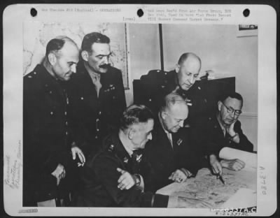 General > Planning a bombing mission 8th Air force England, Target Germany. Left to right: Top row; Lt. Gen. Ira C. Eaker, Brig. Gen. Frank O. Hunter, Brig. Gen. Robert c. Candee Botton row: Gen. D.W. Eisenhower, Maj. Gen. W.H. Frank.