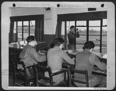 General > Here are the men at the end of the England--France shuttle service which has been giving 24-hour service since the start of the invasion. They are control tower operators at an Eighth AAF Fighter Station where North American P-51 Mustangs led by Col.