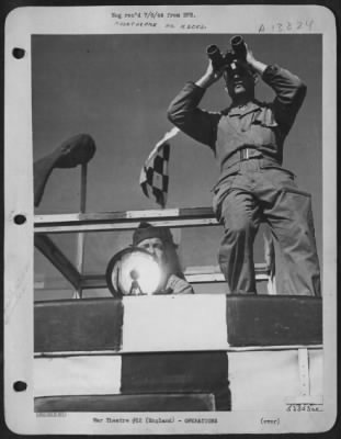 General > Boys in the mobile flying control van stand by to guide the planes in to a safe landing. The van is the "deputy" controller of all ground and air traffic on the airdrome, checking taxiing ships, take-offs and landings, and seeing that the skies in