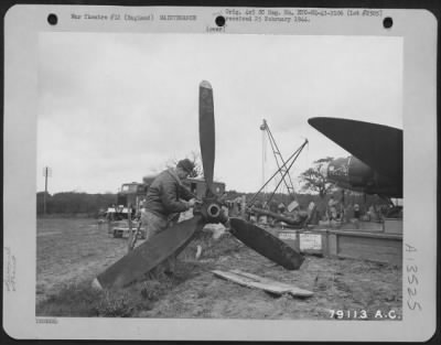 Propellers > Cpl. James A. Taylor, Cleveland, Ohio, Repairs The Propeller Of The Boeing B-17 "Flying Fortress" "Stella", Which Crash Landed In A Field At Nr. Bournemouth, Hants, England.  Cpl. Taylor Is A Member Of The Mobile Repair Unit Of The 8Th Air Force Service C