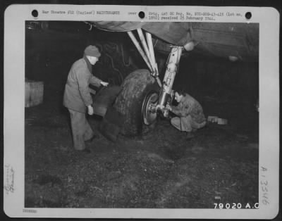 Thumbnail for Tires & Wheels > Pfc Eugene Nachaven, Des Plaines, Ill., And S/Sgt. Frederick R. Landry, Baton Rouge, La., Repair Landing Gear Of Boeing B-17 "Flying Fortress" Grounded At Dawlish, England.  March 1943.