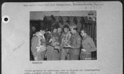 Thumbnail for General > Pilots Gathered In Operations Room In England For Interrogation After A Combat Mission.  22 February 1945.