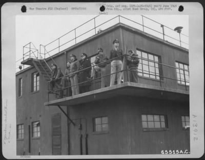 Thumbnail for General > Navy Captain Who Is Visiting The 401St Bomb Group At An 8Th Air Force Base In England And Air Force Personnel Scan The Skies For Approaching Planes, 26 February 1945.